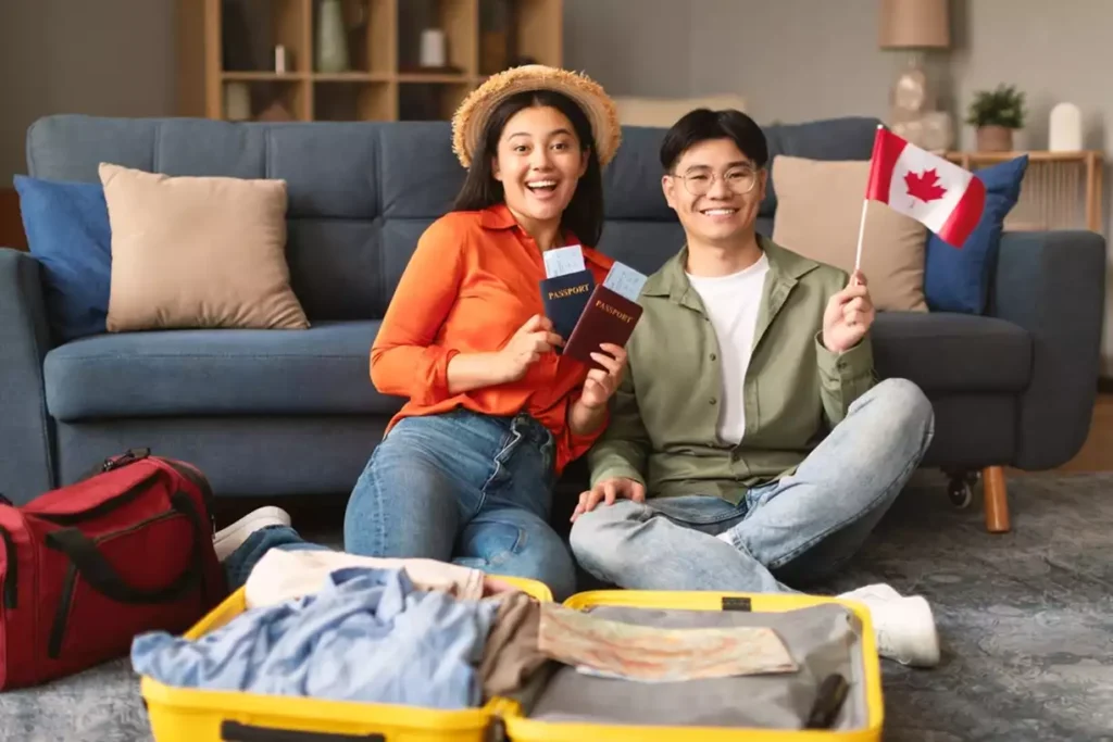 Asian couple holding passports and American flag