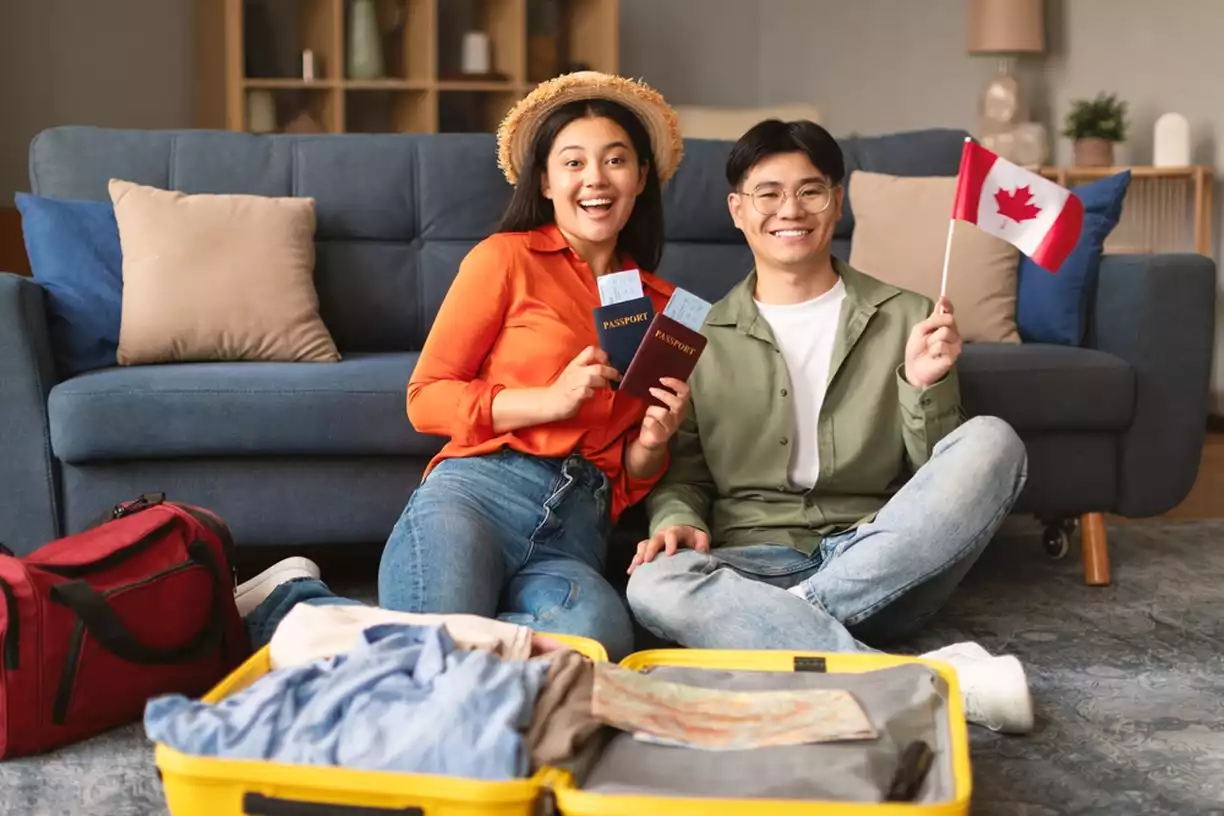 Asian couple holding passports and American flag
