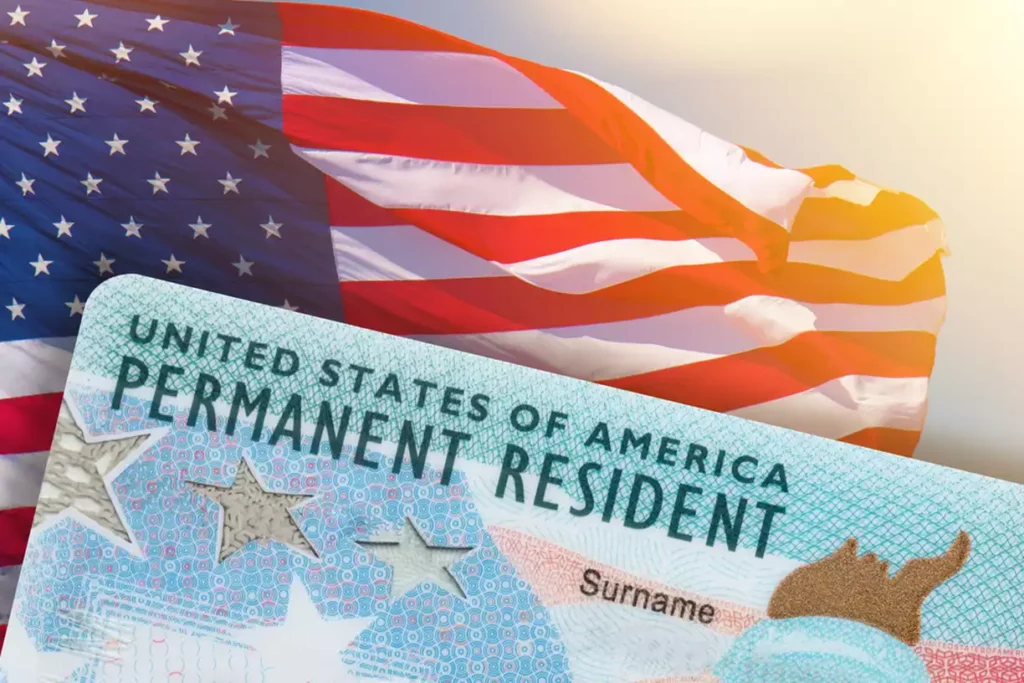 Permanent resident card in front of an American flag